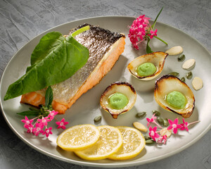 colorful food art composition on plate with peace of fish.Top view.