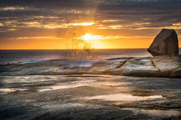 Sunrise through the clouds, Bicheno blowhole Tasmania.
