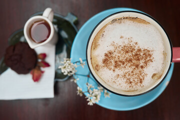 pot of tea with cake and coffee. Orange. Morning