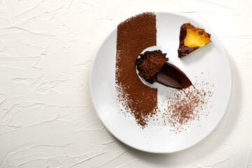 Chocolate cake with fruits on white background.Chocolate truffle. Plate art composition.