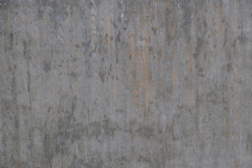 Textured background of an old wall made of beige plaster. Smooth surface. Copy space. Old peeling plaster wall, crumbles. Concrete is made under the gray wood texture.