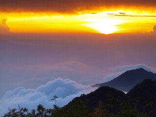 sunset with sea of clouds in the mountains