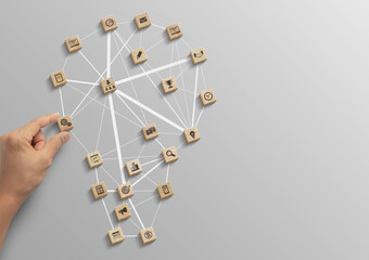 Business strategy, business management or business success concept. Hand is arranging wooden blocks...
