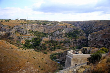 Fototapeta na wymiar View from the Sassi of the Gravina stream gorge in the Murgia of Matera, European Capital of Culture 2019