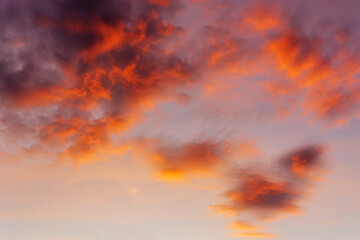 Fototapeta premium Sky and clouds in bright rainbow colors and smooth red colored sky in twilight - Perfect image as a background