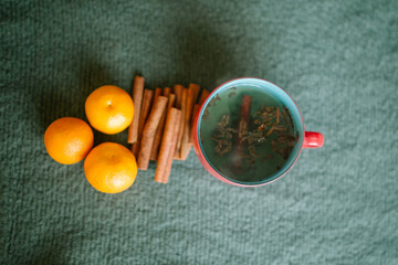 cup of tea and cinnabon sticks on a table