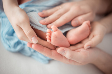 parent holding feet