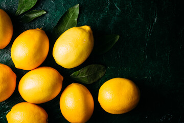 Lemons on a dark green background