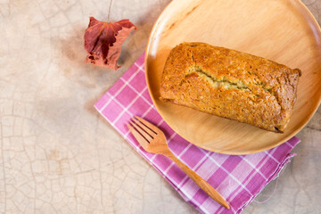 Banana bread loaf on wooden tray, home made bread, ultra-moist healthy banana bread