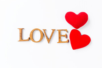 Love and romance concept background, love wooden text with two red heart isolate on white background, valentine background