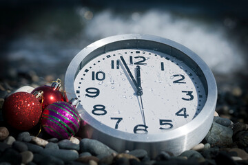 Clock showing nearly midnight and Christmas balls