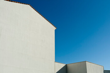 White walls in front of blue sky