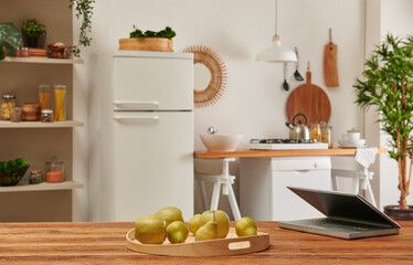 Close up table laptop style and kitchen background.