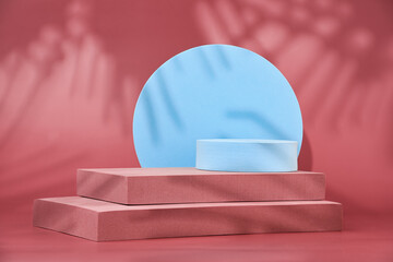 Geometric shapes on a red background, empty podiums for the presentation of various products, abstract geometric background with a pedestal, background with layers of tropical leaves, space for text