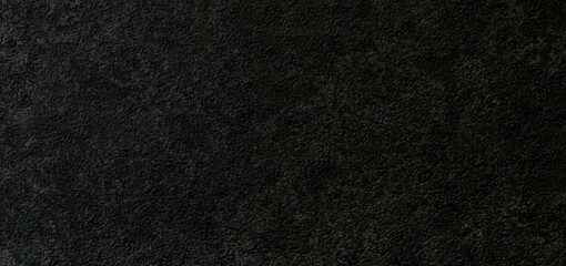 Modern black paint texture background in dark light seamless. home wall paper. granite panoramic stucco surface background grunge wide.