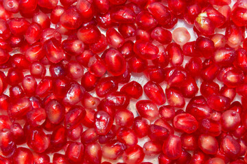 close-up on a pile of peeled pomegranate. selective focus