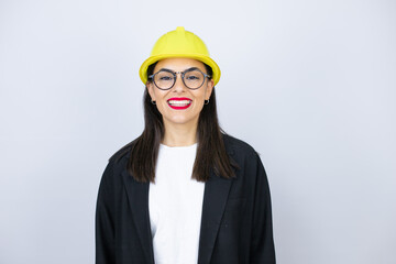 Young architect woman wearing hardhat smiling with a confident smile showing teeth
