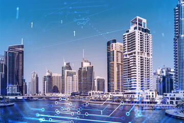 Naklejka premium Skyscrapers of Dubai business downtown. International hub of trading and financial services. Technology theme icons hologram, concept of big data. Double exposure. Dubai Canal waterfront.
