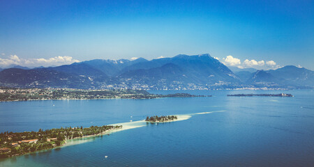 Obraz premium Panoramic aerial view of the southern part of Lake Garda with Island Garda. Region of Sirmione in Italy..