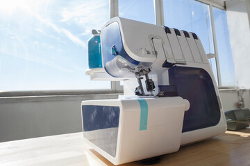 Sewing machine on table in workshop