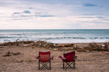 Waves pushing plastic waste to the beach