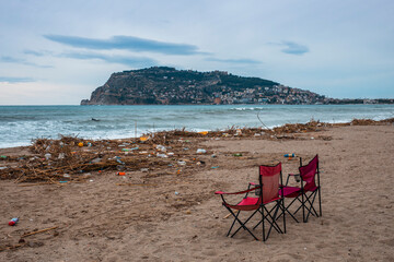 Waves pushing plastic waste to the beach