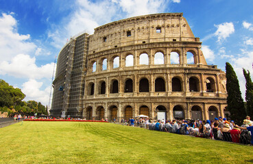 Fototapeta na wymiar The ancient Roman Colosseum also known as the Flavian Amphitheatre in Rome, Italy. It is large amphitheatre and one of the top tourist attractions in Europe 