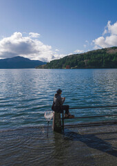 Fototapeta na wymiar Young man fishing in Lake Ashi, Hakone, Japan.