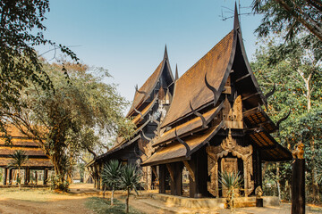 Black Temple, Baan Dam, in Chiang Rai,Thailand, provides collection of skins, bones, teeth of animals.Popular tourist place.Wooden house gold facade.Carved painted wood.Thai style house decor.