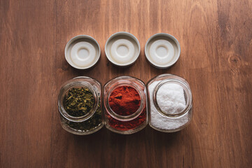 Spices in a jar on a wooden table