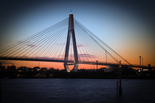 Anzac Bridge at Sunset orange and blue skies Sydney NSW Australia