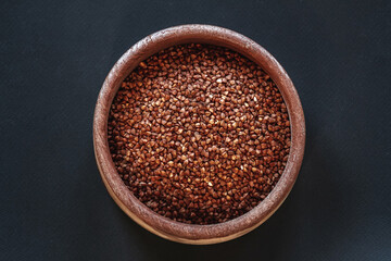 A cereals buckwheat in wooden bowls  top view