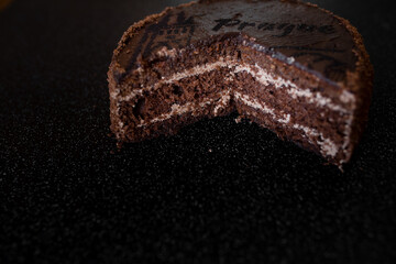 Sponge cake filling. Chopped up chocolate cake with filling visible Close-up. Cake filling. Free space for text