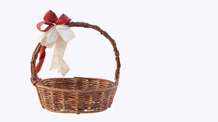Fototapeta na wymiar Brown wicker basket on a white background