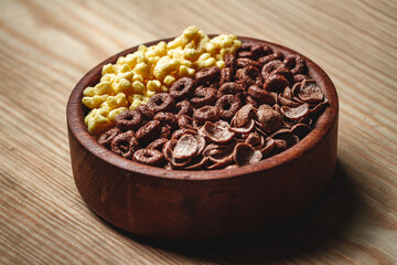 Wooden Bowl with different sorts of quick breakfast cereal products