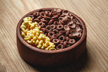Wooden Bowl with different sorts of quick breakfast cereal products