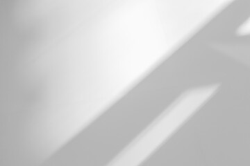 Abstract shadow and striped diagonal light background on white wall  from window,  architecture dark gray and sunshine diagonal geometric effect overlay for backdrop and mockup design