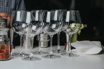 Ice in a glass of wine prepared for a special cocktail for a bartender's bar or restaurant.