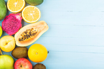 various fresh fruits top blue wooden board (1)
