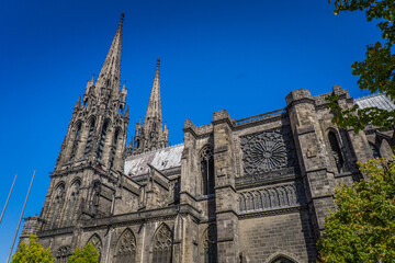 Fototapeta na wymiar View on the gothic cathedral from the Victory square in Clermont Ferrand, Auvergne (France)