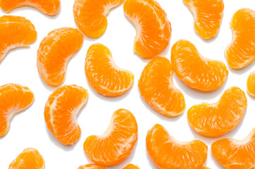 Citrus composition. Consists of tangerine slices on a white background. Top view, flat sunbed, tangerine texture, all tangerines background.