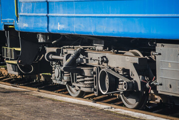 Truskavets, Ukraine - January 2021: Wheels of locomotive CHS7 with a freight train awaiting departure on the platform of the railway station. Ukrzaliznytsia. Ukrainian railways.