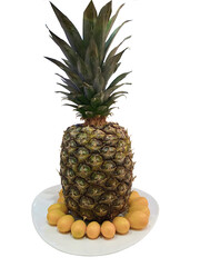 Ripe pineapple on a plate on a white isolated background