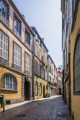 typical facades of houses in the streets of Clermont Ferrand, Auvergne (France)
