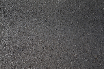 Close up black asphalt road surface texture.