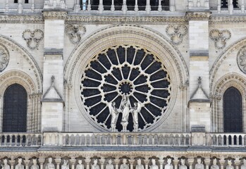 Details facade of the famous Notre-Dame cathedral, in Paris, France.