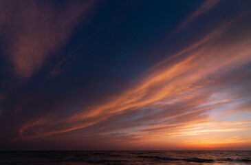 Naklejka na ściany i meble Colorful Sunset sky over the sea