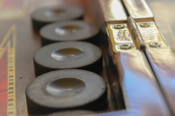 close up of a stack of backgammon checkers. backgammon board game.