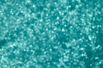 Teal abstract bokeh background.