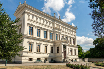 The grand facade of the white university building called Universitetshuset in the medieval town of Lund Sweden